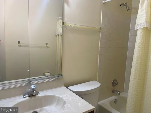a bathroom with a sink and toilet
