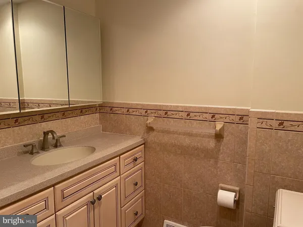 a bathroom with a sink and mirror