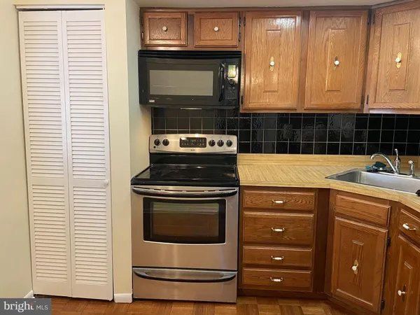 a kitchen with a stove and a microwave