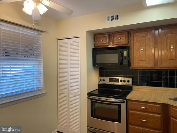 a kitchen with a stove and a microwave