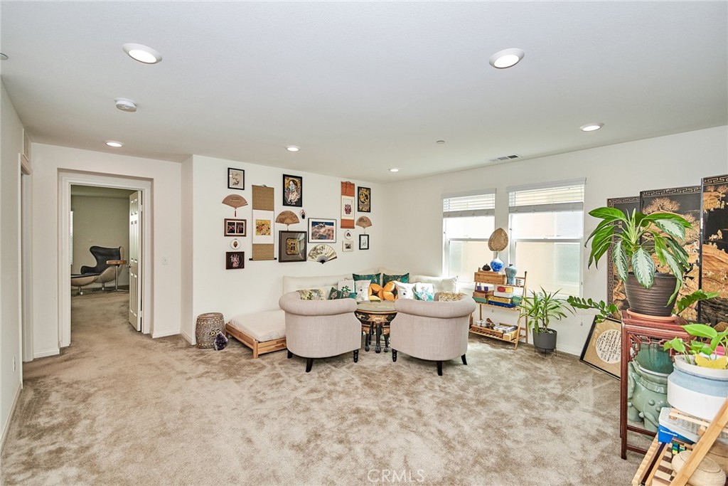 2375 Vineyard Street Upland, CA 91786 - Photo 13 of 58 a living room with furniture and a potted plant