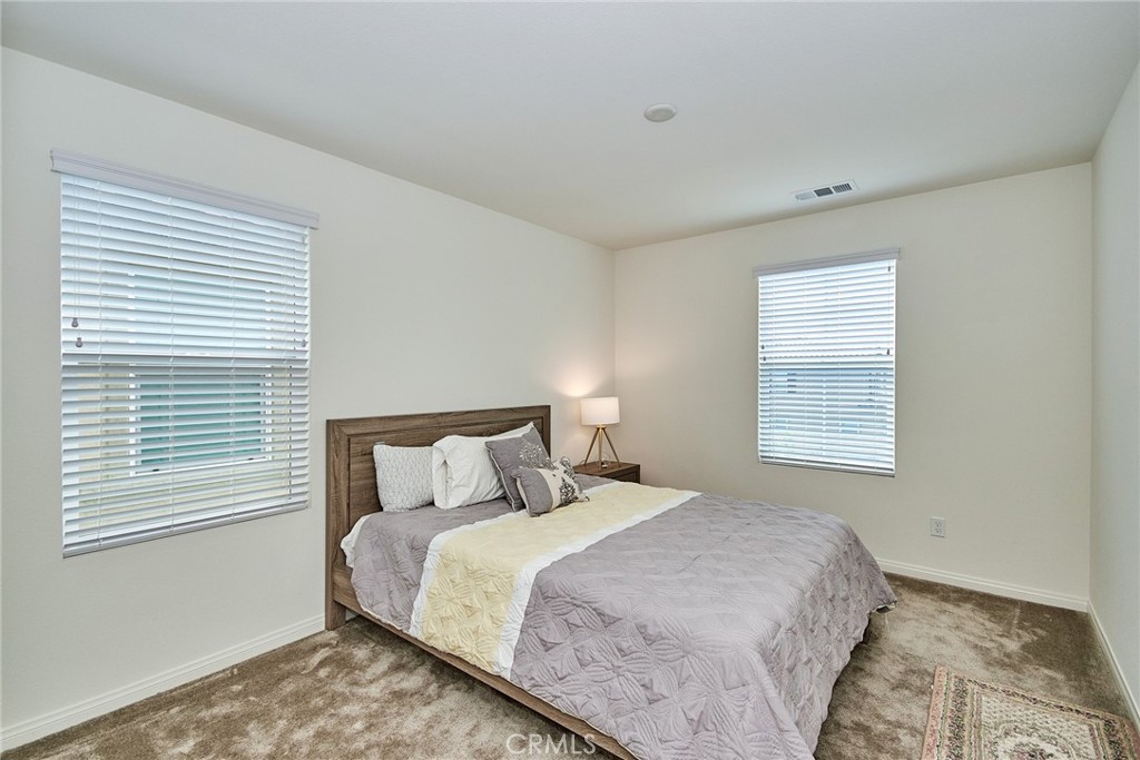 2375 Vineyard Street Upland, CA 91786 - Photo 19 of 58 a bedroom with a bed and a window