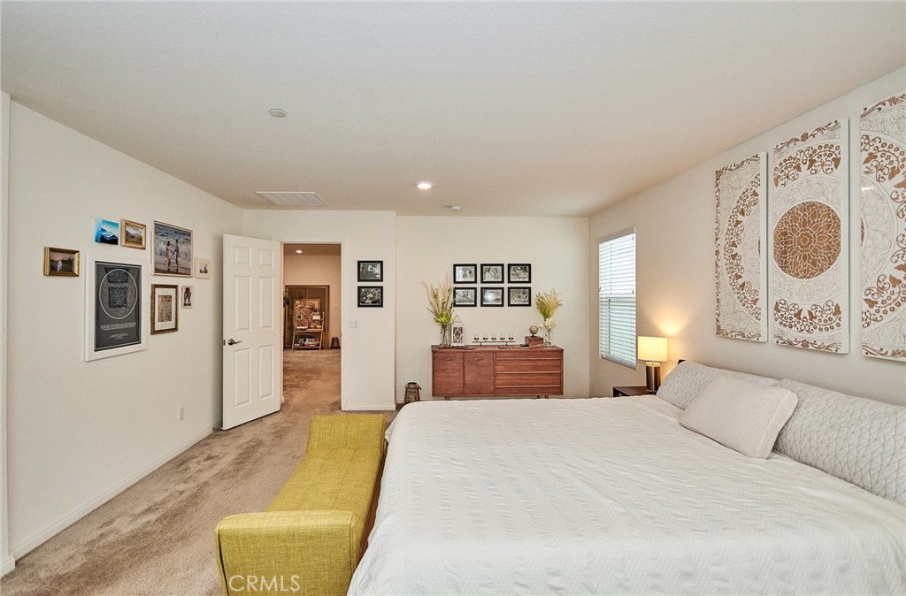 2375 Vineyard Street Upland, CA 91786 - Photo 31 of 58 a bedroom with a large bed and a window