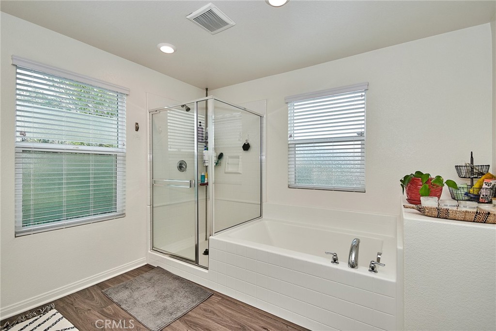 2375 Vineyard Street Upland, CA 91786 - Photo 35 of 58 a bathroom with a tub a sink and a window