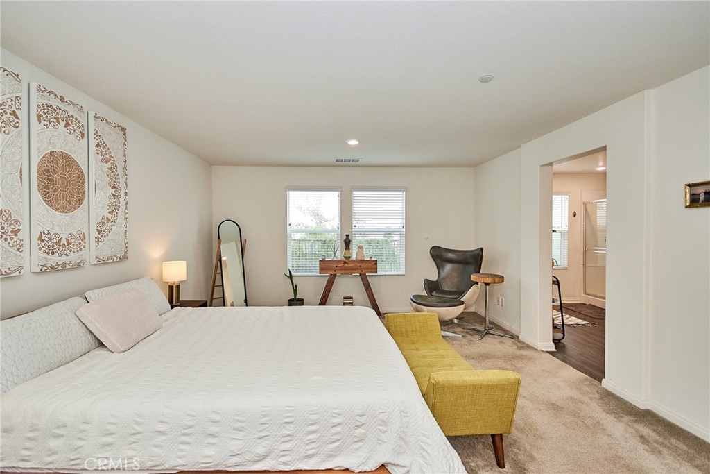 2375 Vineyard Street Upland, CA 91786 - Photo 45 of 58 a bed room with a bed and a chair