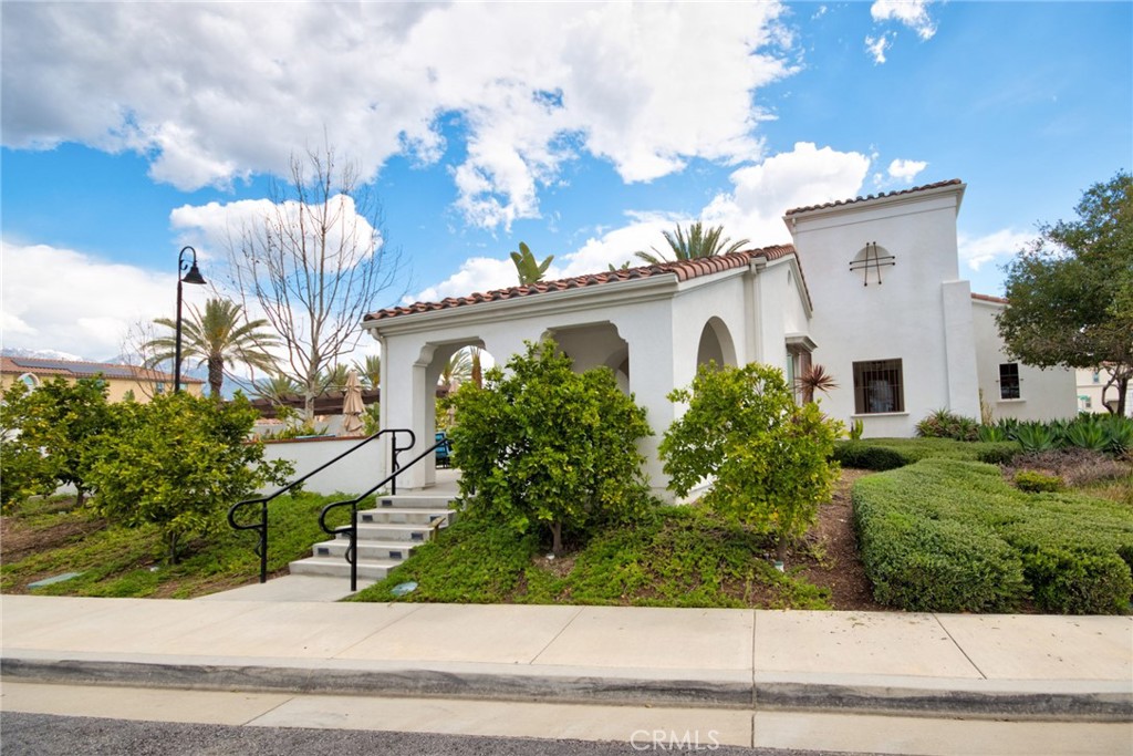 2375 Vineyard Street Upland, CA 91786 - Photo 56 of 58 a front view of a house with a garden