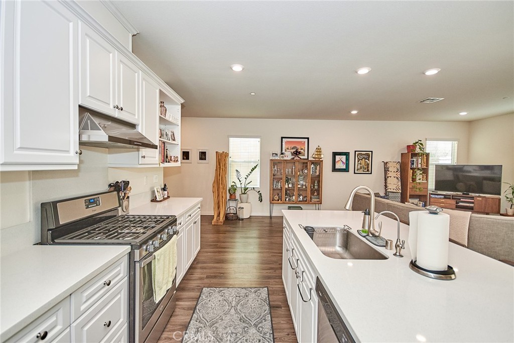 2375 Vineyard Street Upland, CA 91786 - Photo 9 of 58 a kitchen with stainless steel appliances granite countertop a sink stove and refrigerator