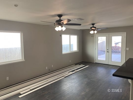 1536 Sims Street Ridgecrest, CA 93555 - Photo 8 of 19 a view of an empty room with window chandelier fan