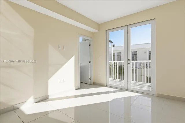 a view of a hallway with windows