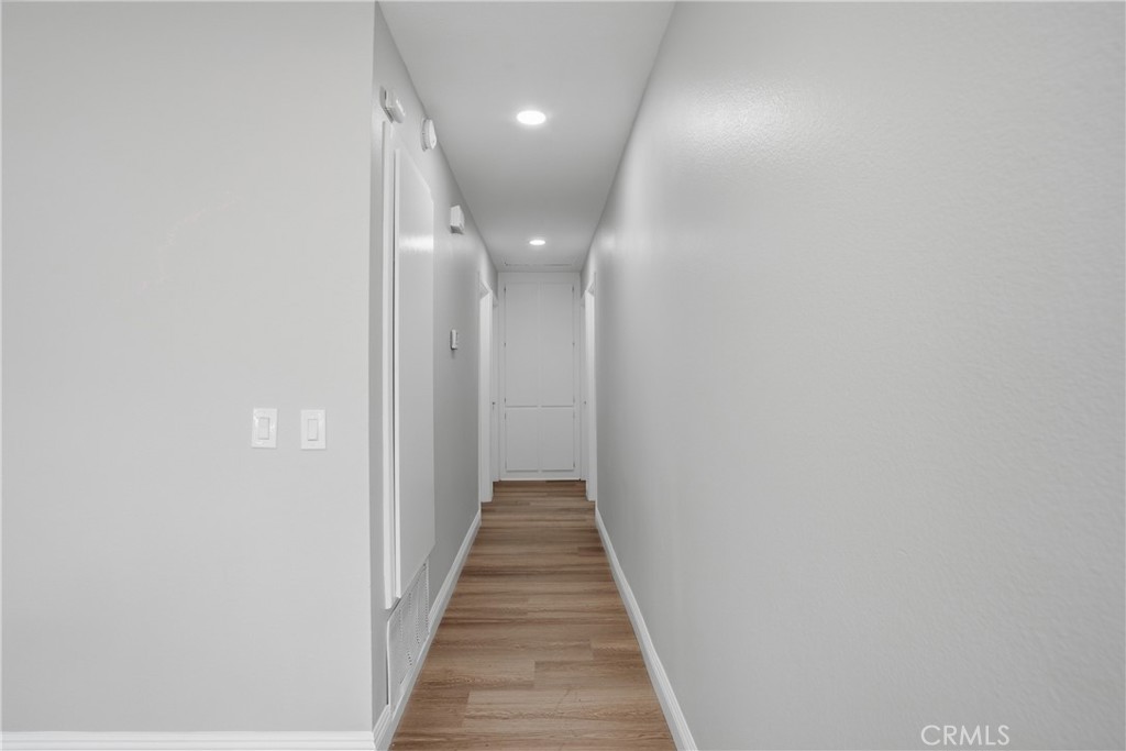2924 Louisiana Place Riverside, CA 92506 - Photo 26 of 42 a view of a hallway with wooden floor