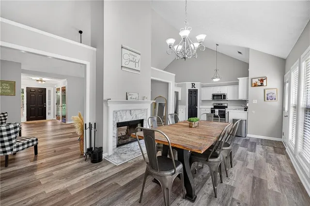a view of a dining room with furniture and wooden floor