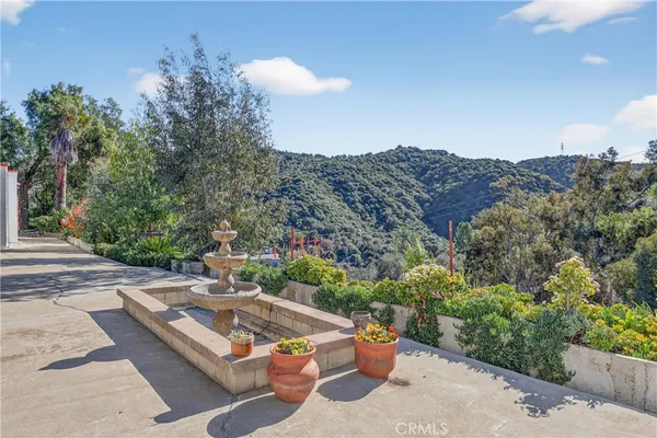 a view of a patio with a table and chairs