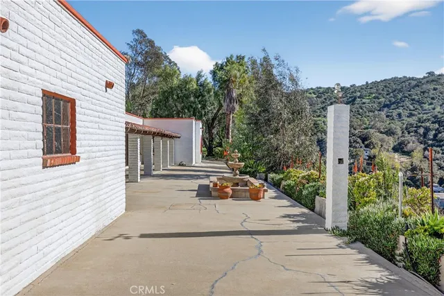 a view of a house with sitting area and garden