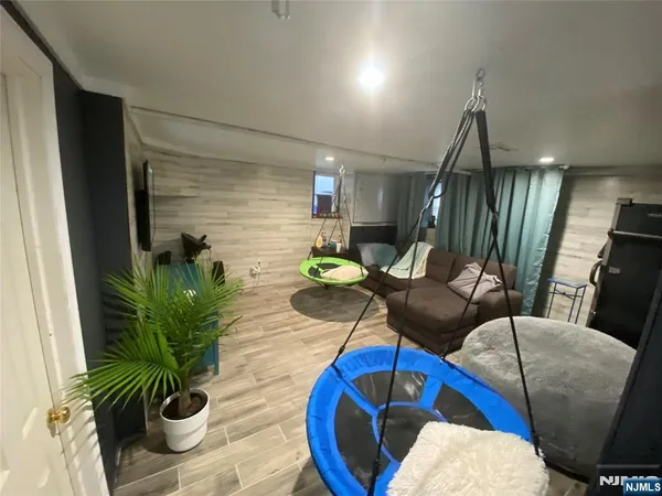a living room with furniture rug and wooden floor