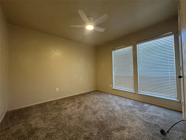a bathroom with a double vanity sink toilet mirror and shower