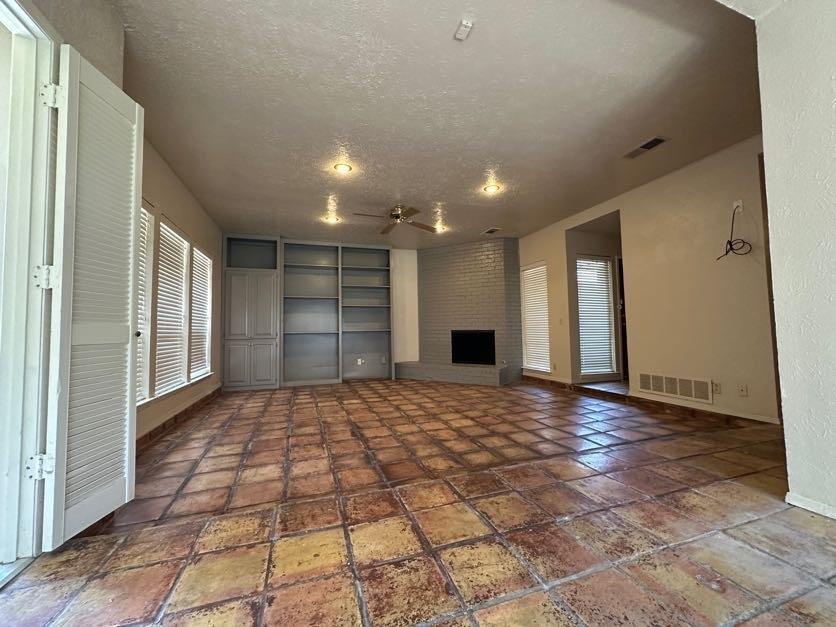 1900 Tree House Lane Plano, TX 75023 - Photo 5 of 18 a view of an empty room and window