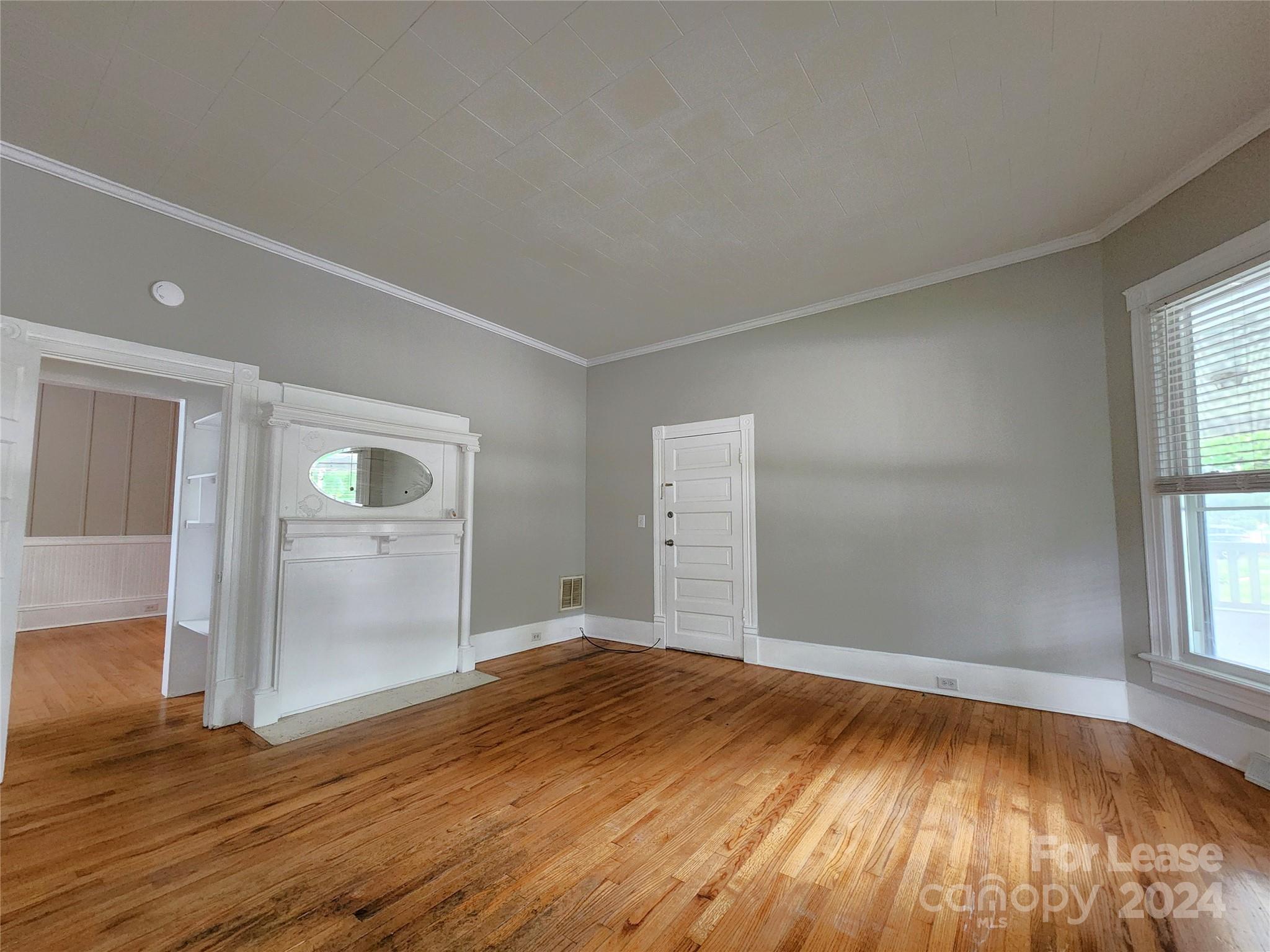 1126 South Fulton Street, Unit B Salisbury, NC 28144 - Photo 1 of 17 an empty room with wooden floor and windows