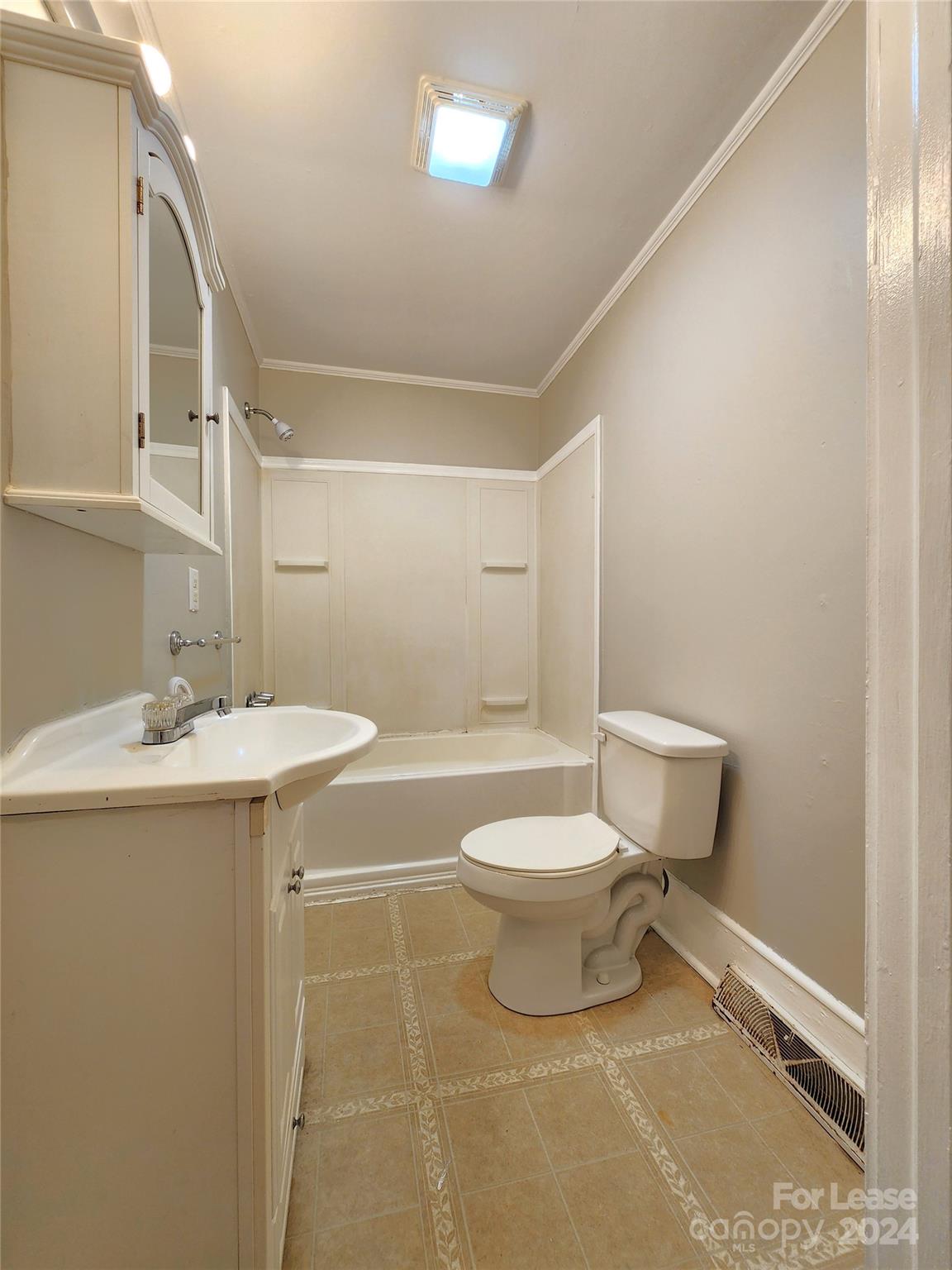 1126 South Fulton Street, Unit B Salisbury, NC 28144 - Photo 13 of 17 a bathroom with a sink toilet and shower