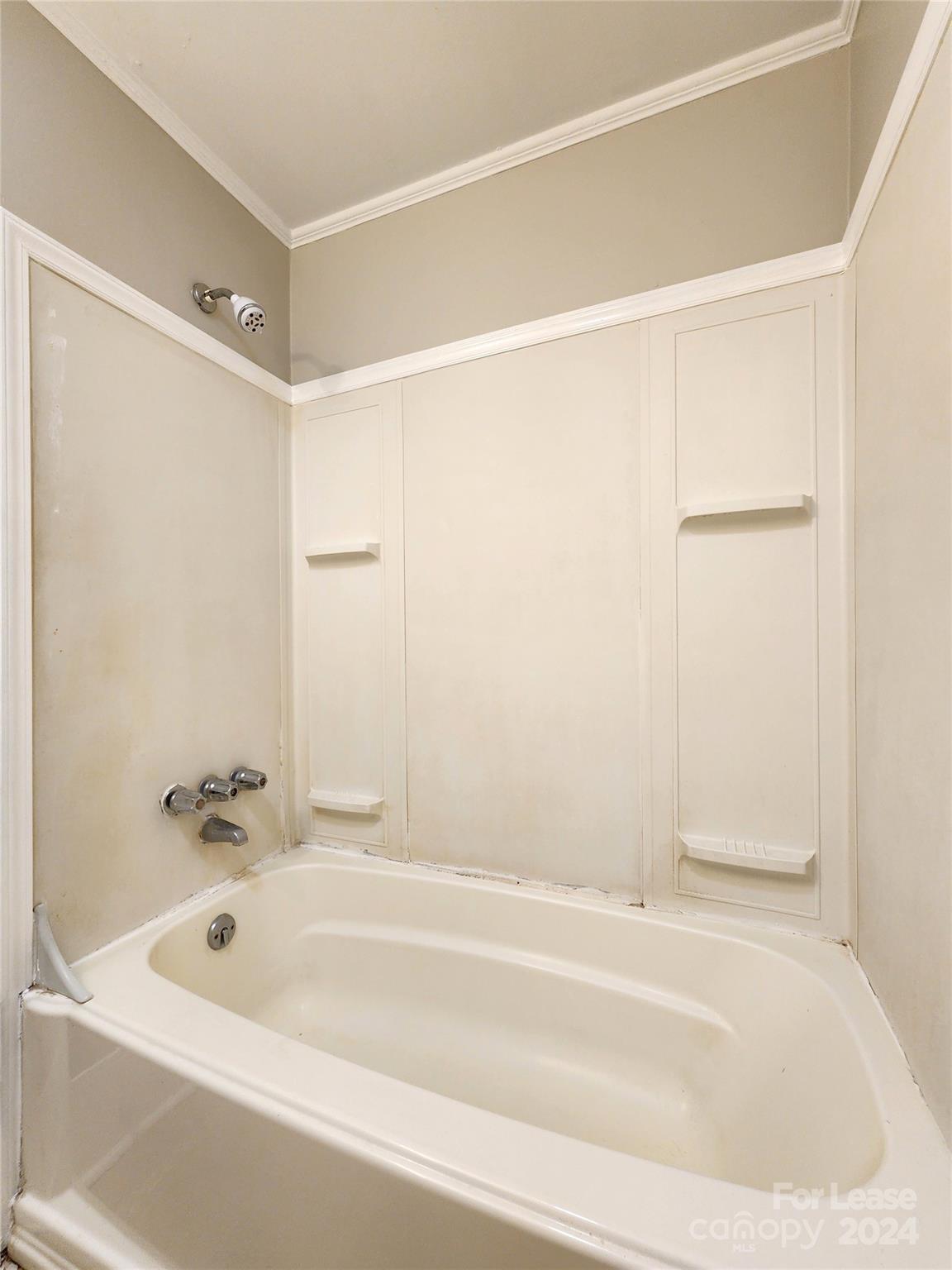 1126 South Fulton Street, Unit B Salisbury, NC 28144 - Photo 14 of 17 a bathroom with a bathtub and a shower