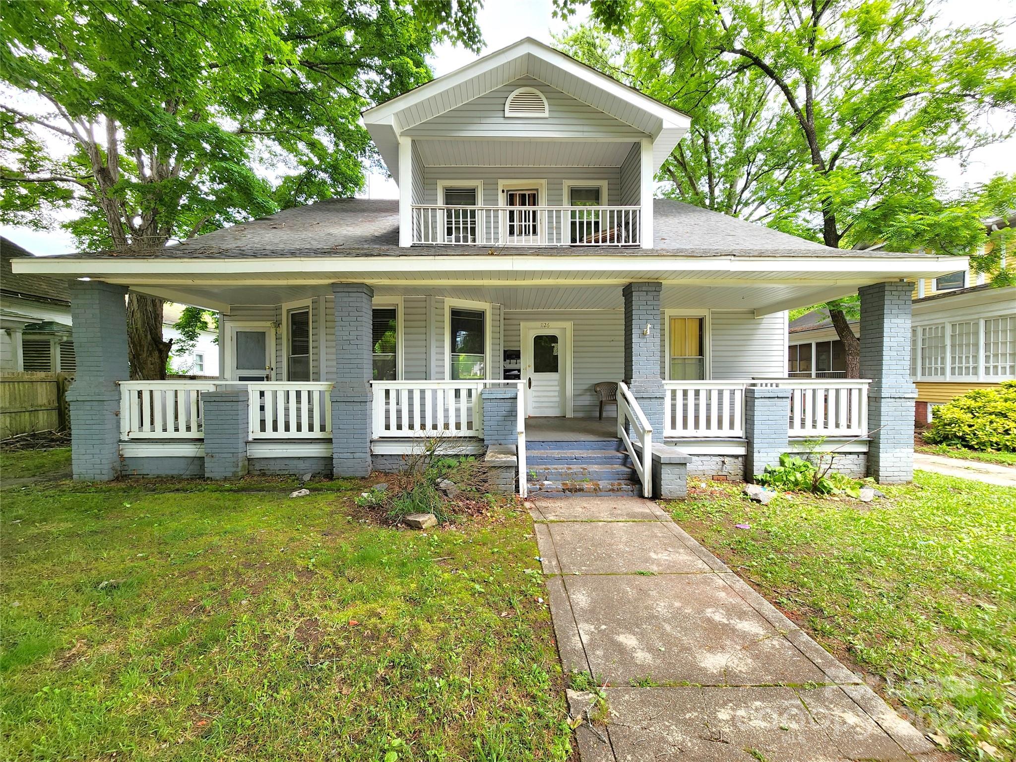 1126 South Fulton Street, Unit B Salisbury, NC 28144 - Photo 2 of 17 a front view of a house with a yard and fence