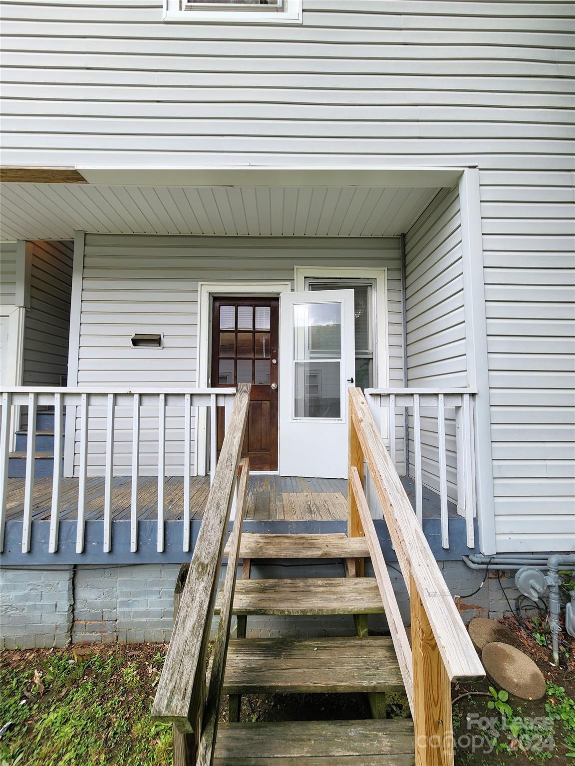 1126 South Fulton Street, Unit B Salisbury, NC 28144 - Photo 3 of 17 a view of wooden balcony with a bench