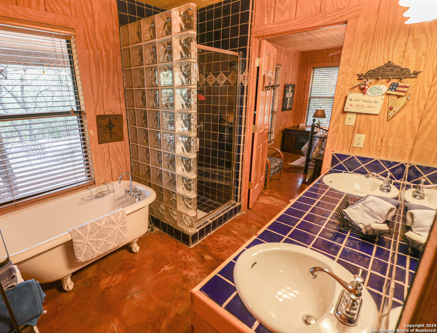 1177 River Road Concan, TX 78838 - Photo 19 of 34 a bathroom with a bathtub and shower