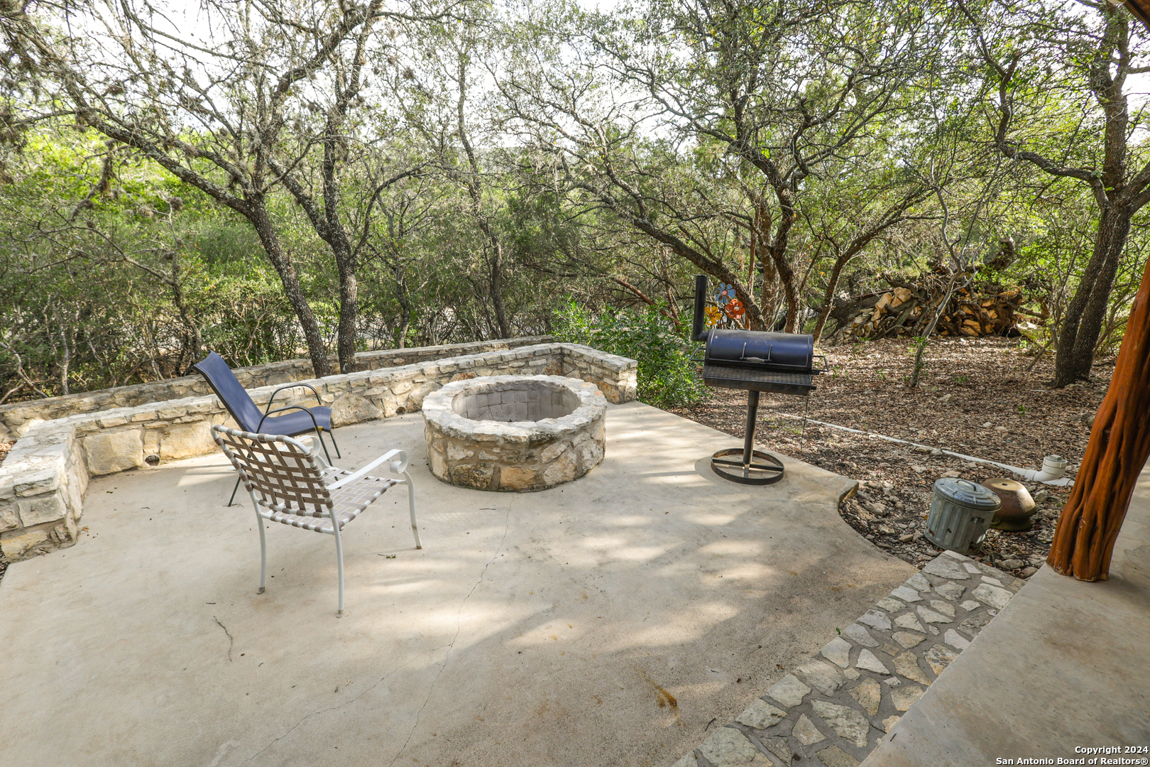 1177 River Road Concan, TX 78838 - Photo 26 of 34 a view of a patio with a table and chairs