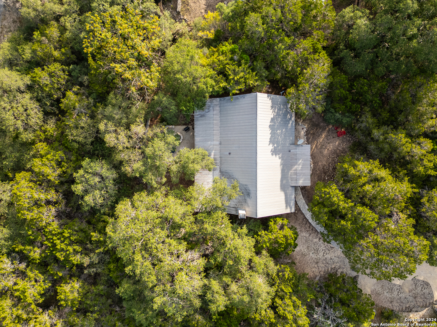 1177 River Road Concan, TX 78838 - Photo 34 of 34 an aerial view of a house with a yard
