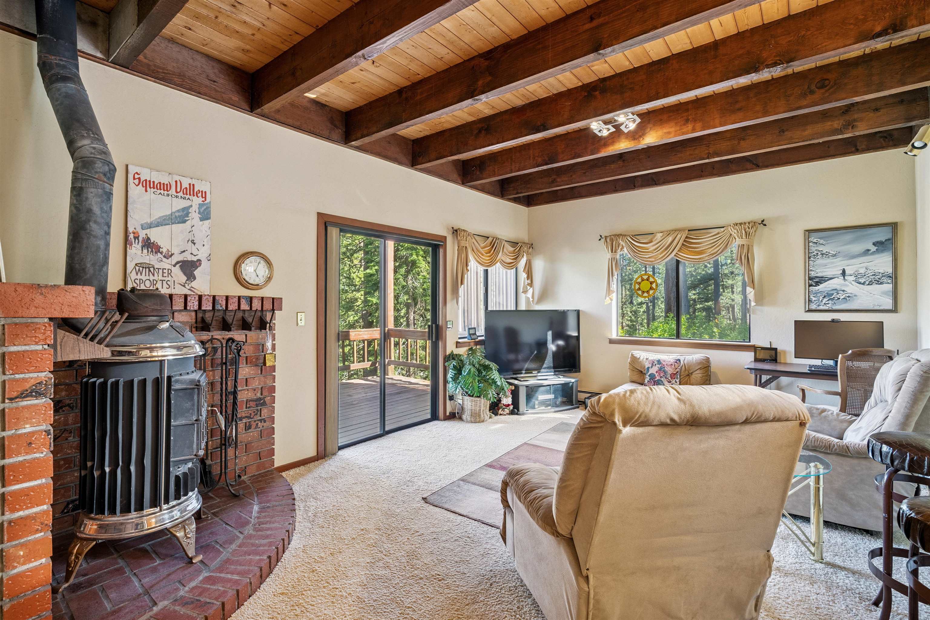 1449 Sandy Way Olympic Valley, CA 96146 - Photo 14 of 27 a bed room with furniture a flat screen tv and a large window