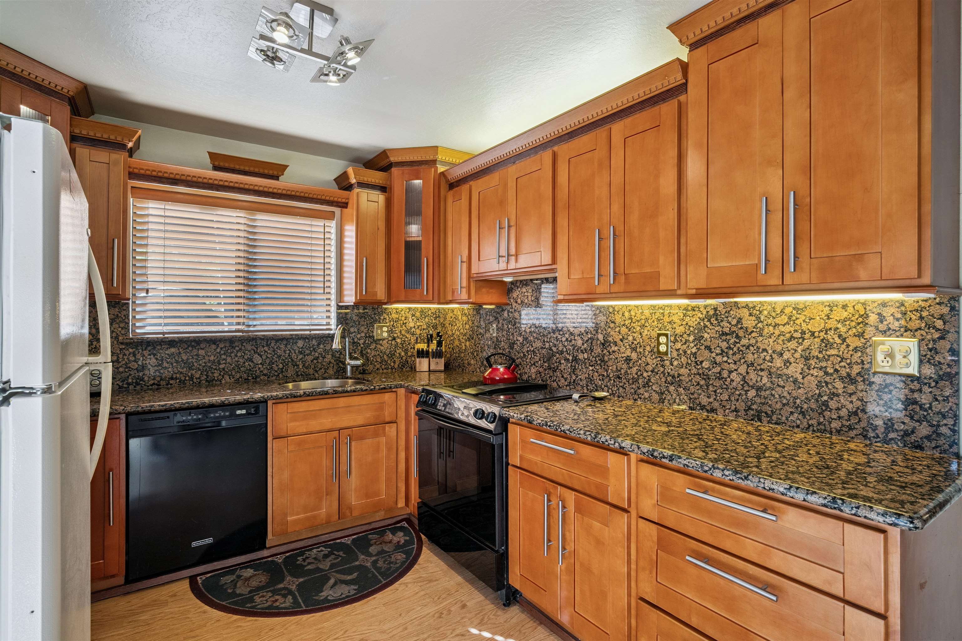 1449 Sandy Way Olympic Valley, CA 96146 - Photo 18 of 27 a kitchen with stainless steel appliances granite countertop a sink stove and refrigerator