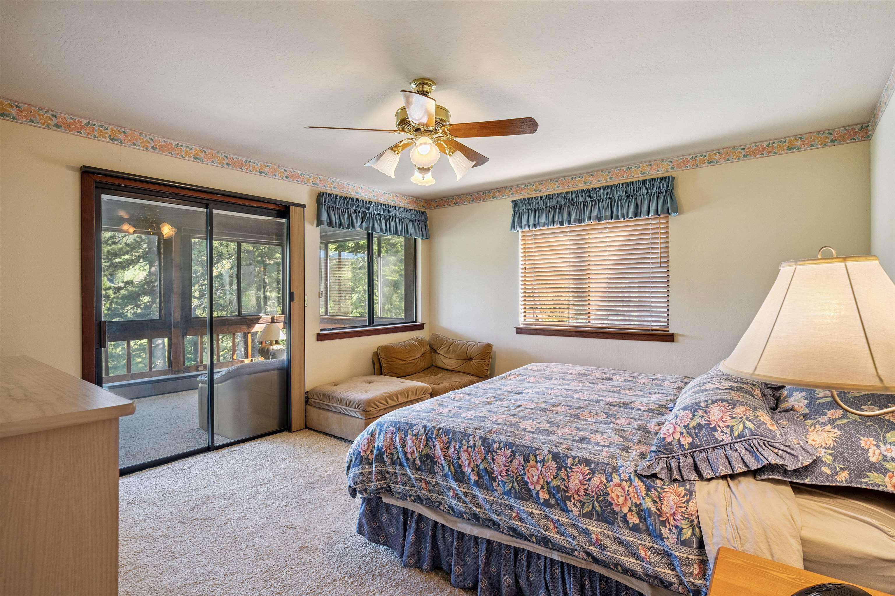 1449 Sandy Way Olympic Valley, CA 96146 - Photo 21 of 27 a bedroom with a large bed and a chandelier
