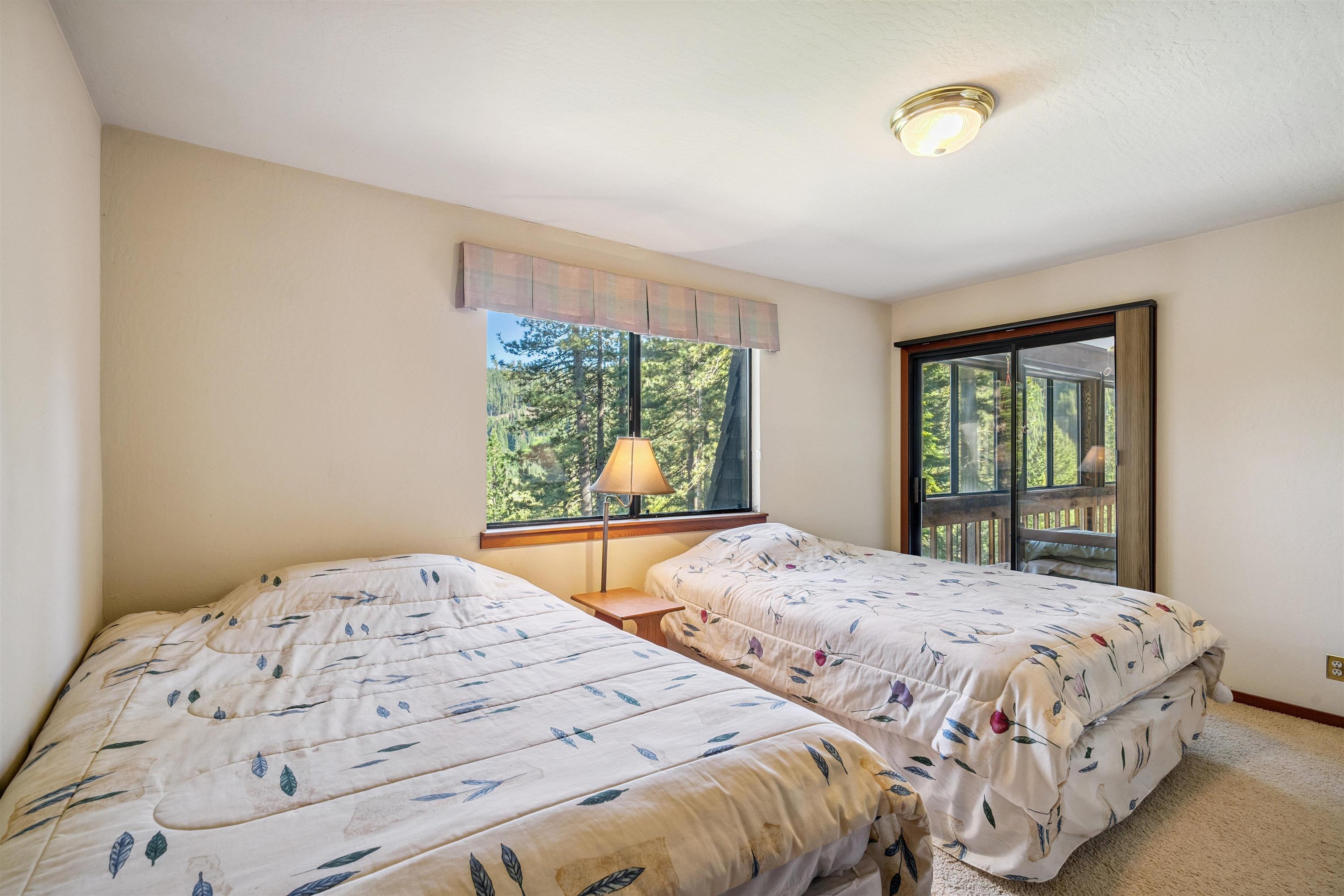 1449 Sandy Way Olympic Valley, CA 96146 - Photo 23 of 27 a bedroom with a large bed and a window