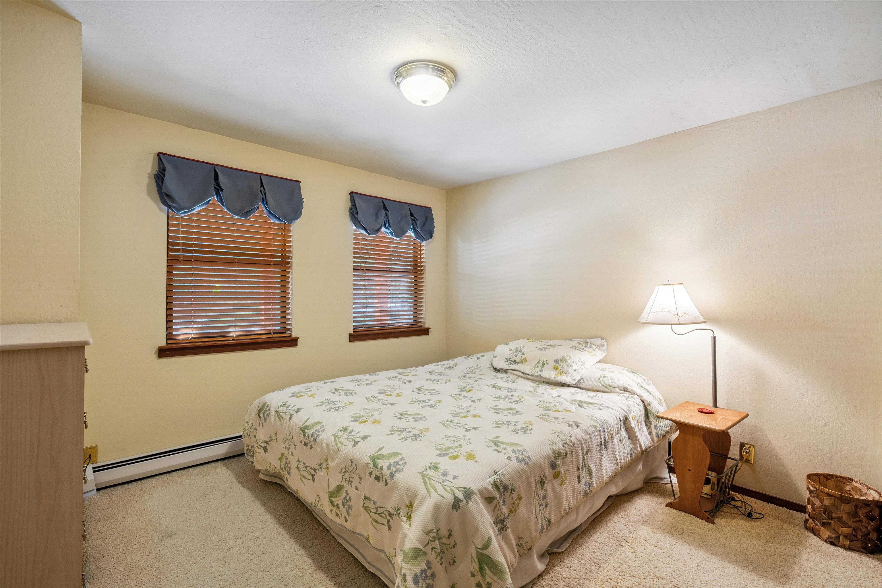 1449 Sandy Way Olympic Valley, CA 96146 - Photo 24 of 27 a bedroom with a bed and a lamp with the wooden floor