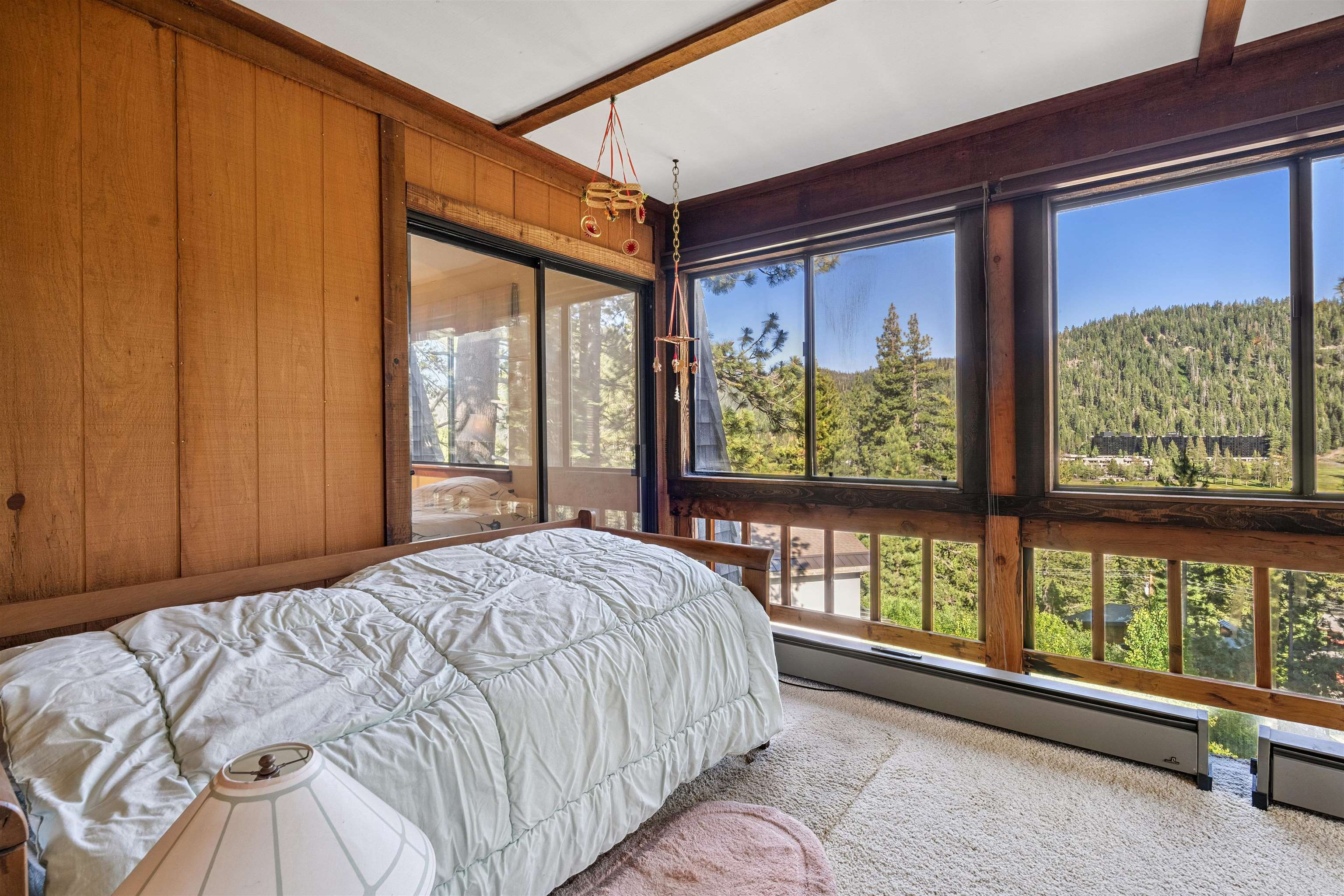 1449 Sandy Way Olympic Valley, CA 96146 - Photo 27 of 27 a bed sitting in a bedroom next to a window
