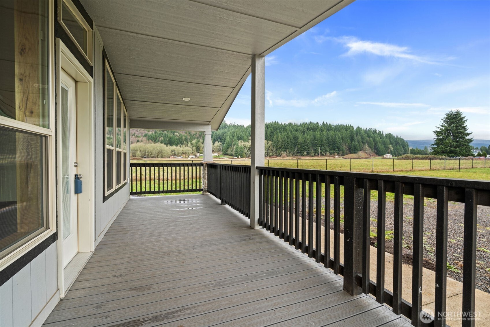 210 Mossyrock Road West Mossyrock, WA 98564 - Photo 13 of 38 a view of a balcony with wooden floor