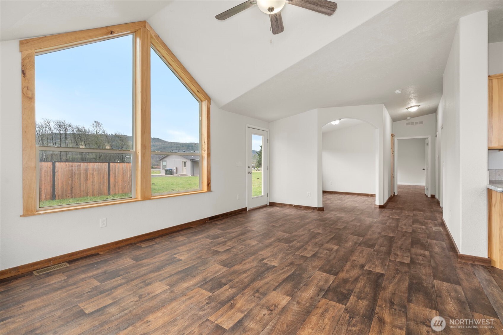 210 Mossyrock Road West Mossyrock, WA 98564 - Photo 15 of 38 a view of an empty room with a window and wooden floor