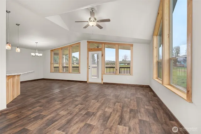 a kitchen with stainless steel appliances granite countertop a kitchen island a stove a sink dishwasher and a refrigerator