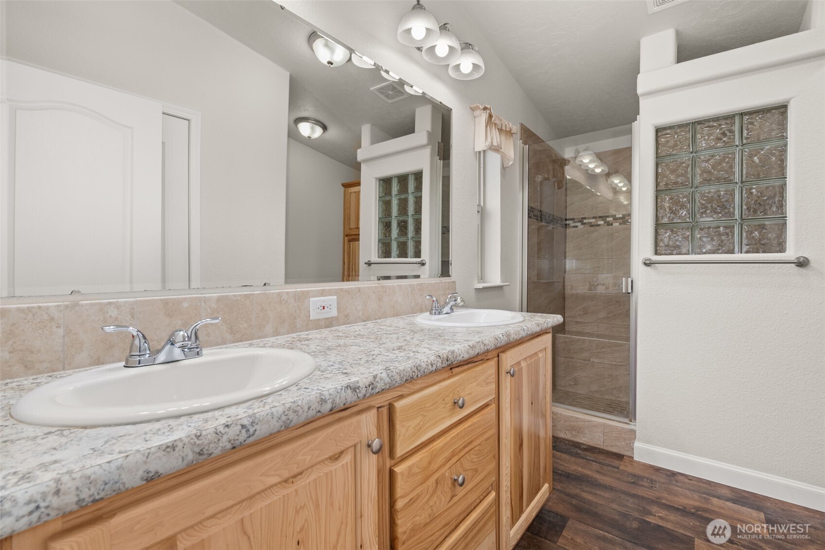 210 Mossyrock Road West Mossyrock, WA 98564 - Photo 24 of 38 a bathroom with a granite countertop sink and a mirror