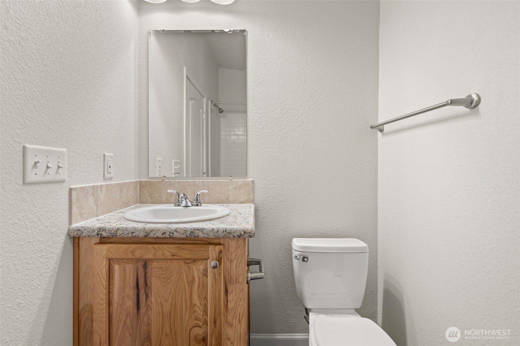 210 Mossyrock Road West Mossyrock, WA 98564 - Photo 28 of 38 a bathroom with a granite countertop toilet sink and mirror