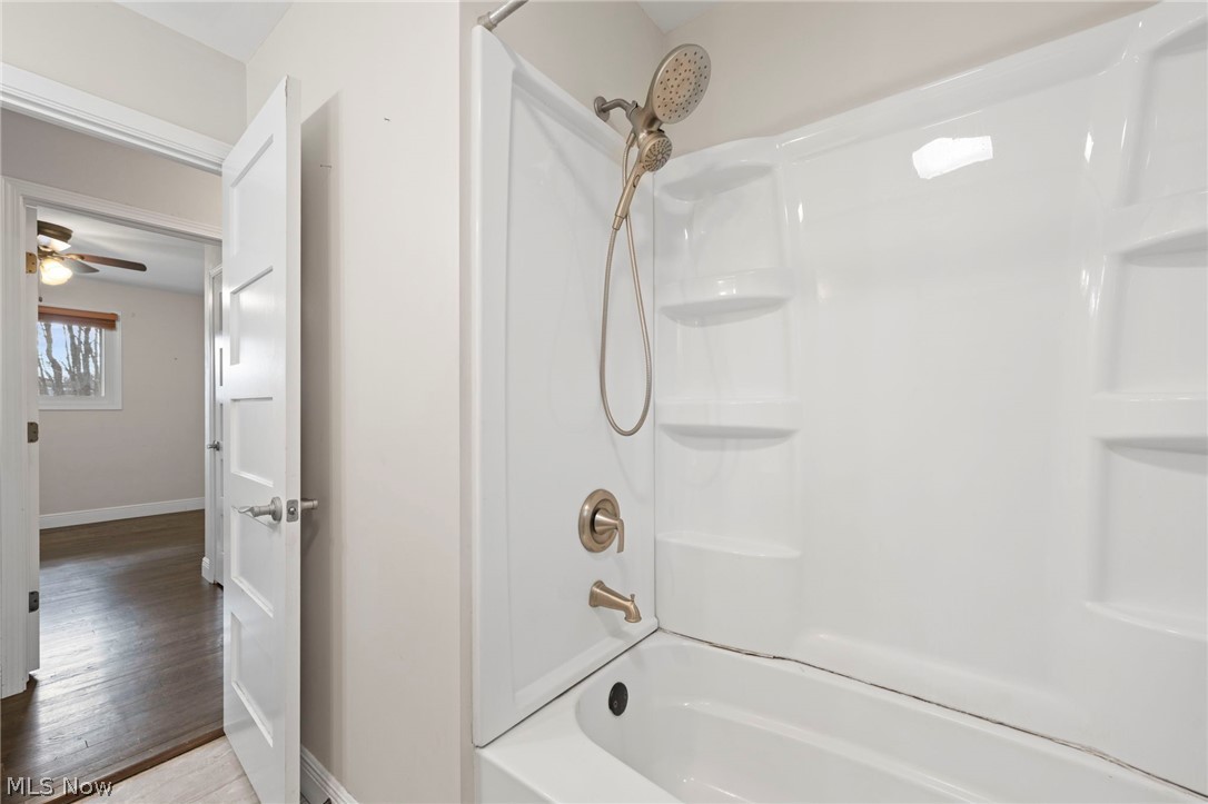 1835 Windham Road Newton Falls, OH 44444 - Photo 20 of 40 Bathroom featuring shower combination, light wood-style flooring, and ceiling fan