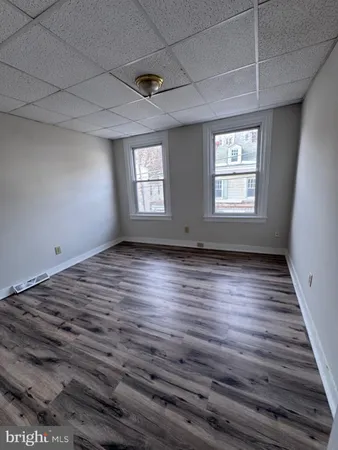 a view of room window and wooden floor