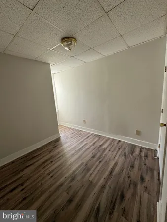 an empty room with wooden floor