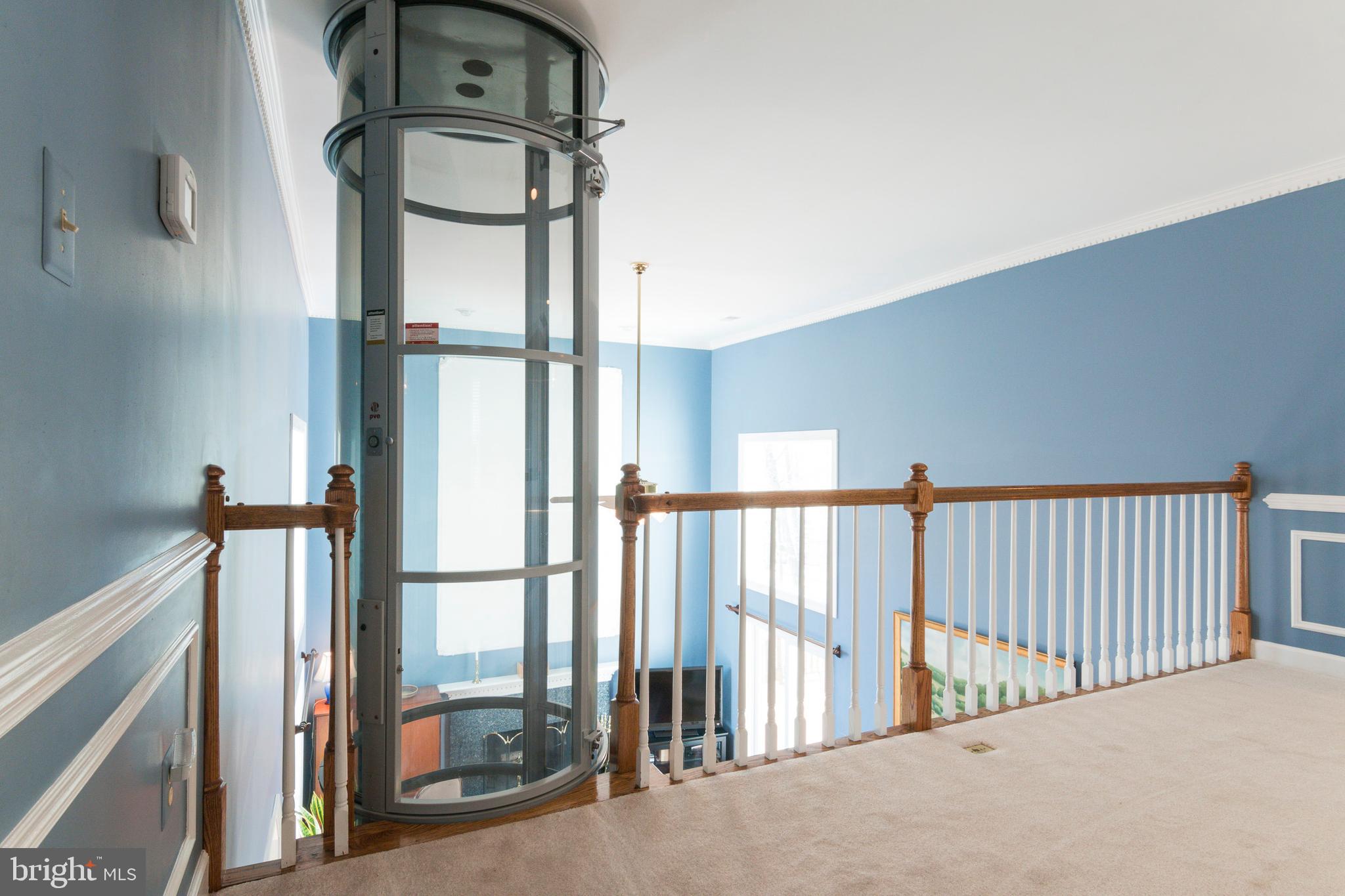 533 Post Oak Road Annapolis, MD 21401 - Photo 29 of 65 Upper level landing with elevator