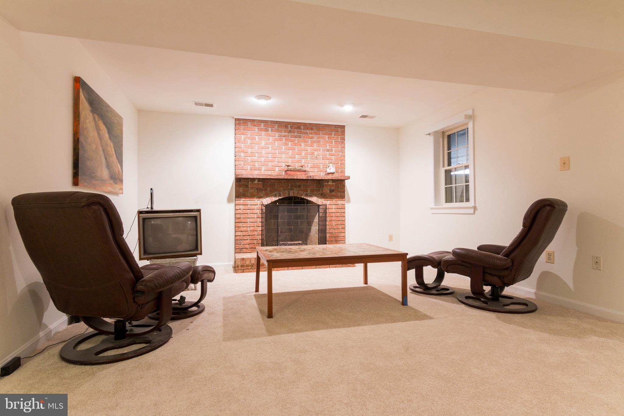 533 Post Oak Road Annapolis, MD 21401 - Photo 52 of 65 Den area with fireplace in basement
