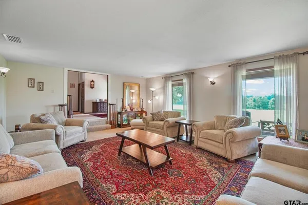 a living room with furniture and a large window