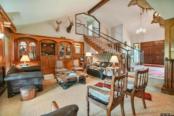 a bedroom with a bed wooden floor and window