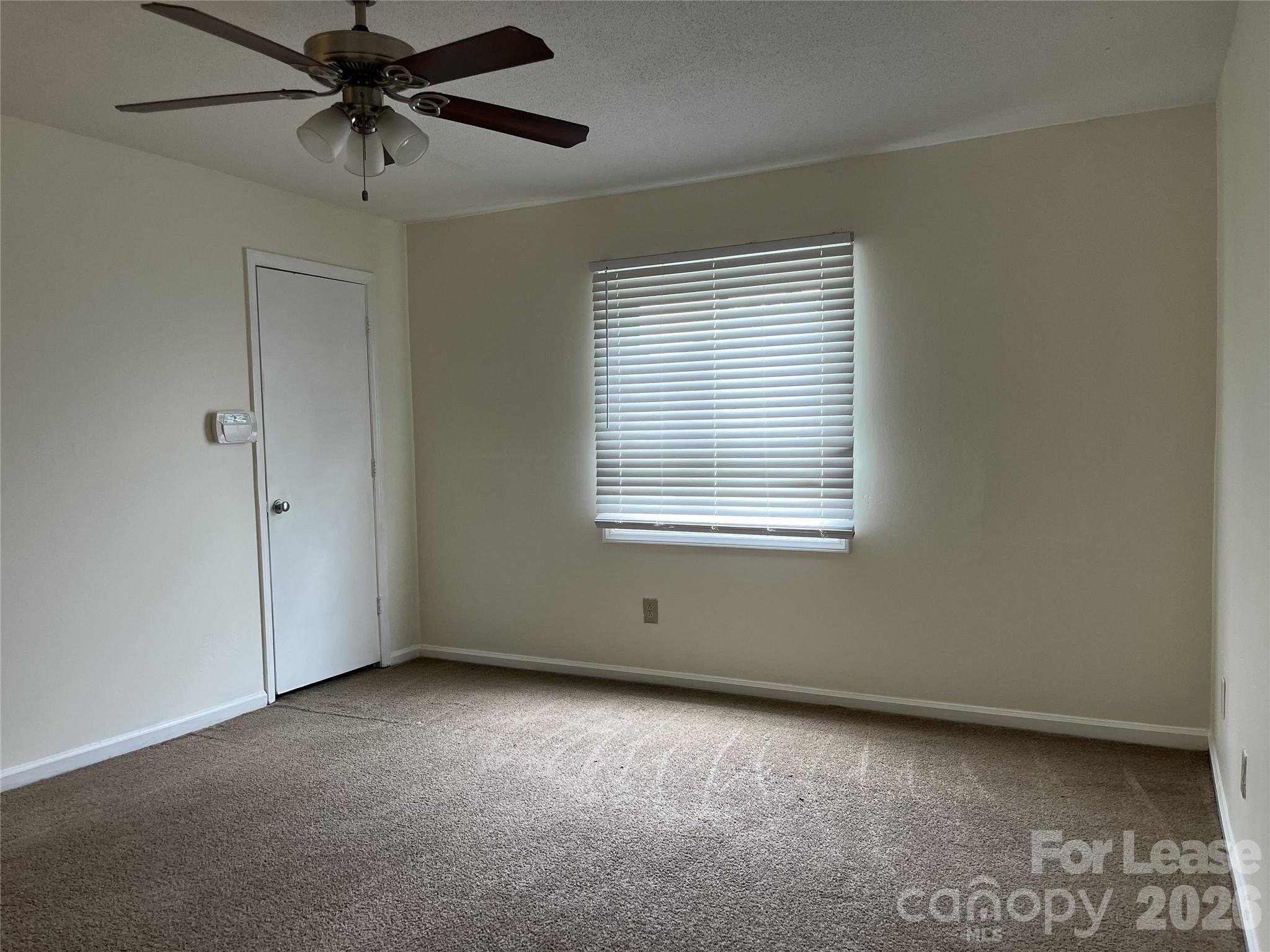 1911 Smoke Ridge Court, Unit 5 Charlotte, NC 28210 - Photo 10 of 16 a view of an empty room with a window
