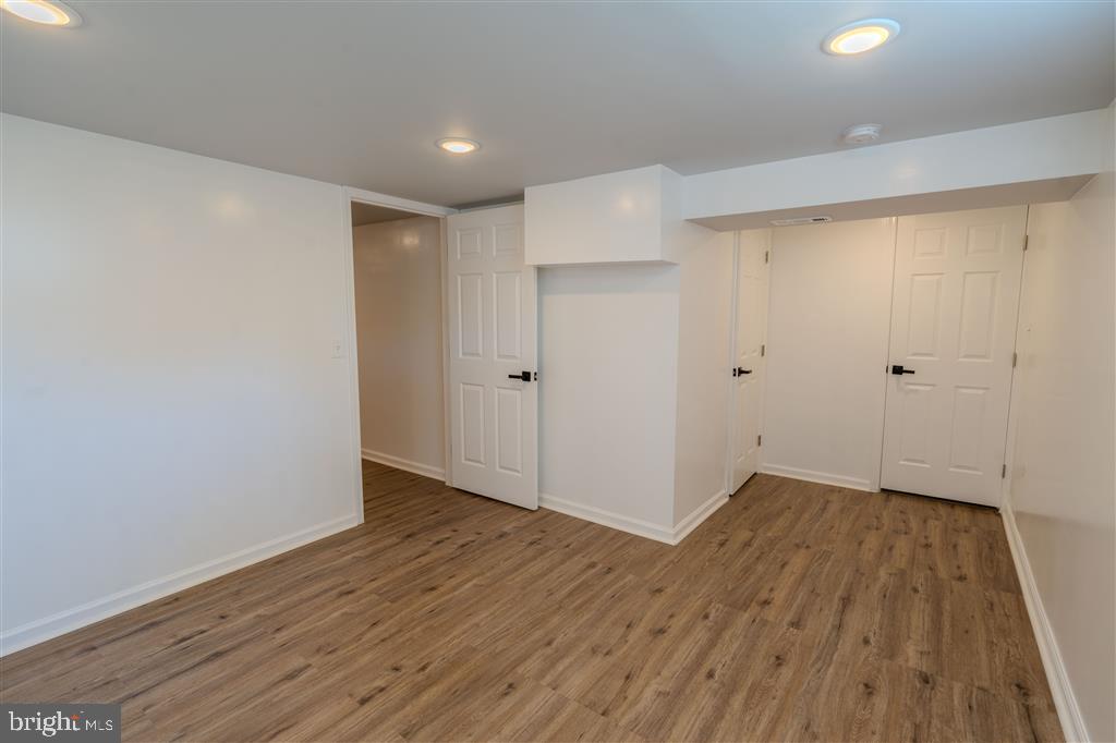 12324 Centerhill Street Silver Spring, MD 20902 - Photo 21 of 24 a view of an empty room with wooden floor