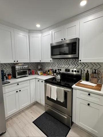 a kitchen with a stove and a sink