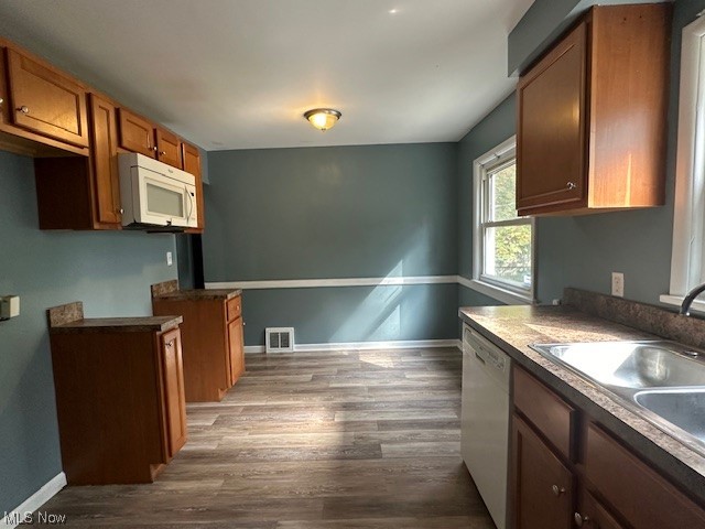 4230 Bluestone Road South Euclid, OH 44121 - Photo 3 of 35 Kitchen featuring sink, hardwood flooring, and white appliances